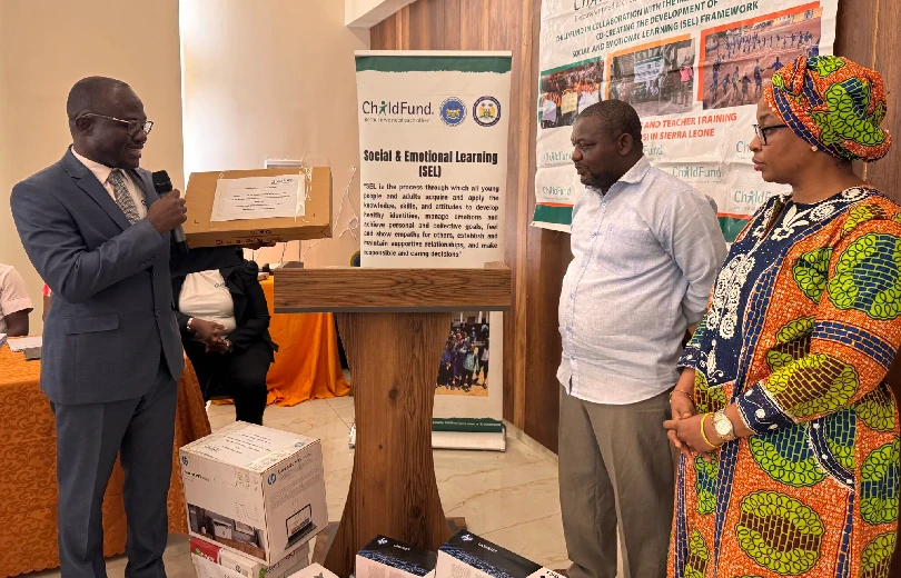Victor Kamara donating laptop computers and stationery to help the two ministries champion SEL