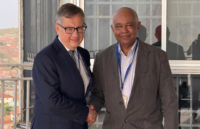 Photo of Isam (right) and His Excellency Jacek Jankowski (left)