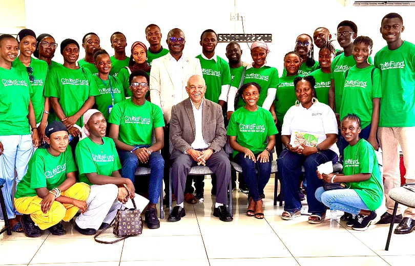  Isam, Victor Kamara, Country Director, ChildFund Sierra Leone and Isatu Venn, Programs and Sponsorship Director pose for a photo with youth
